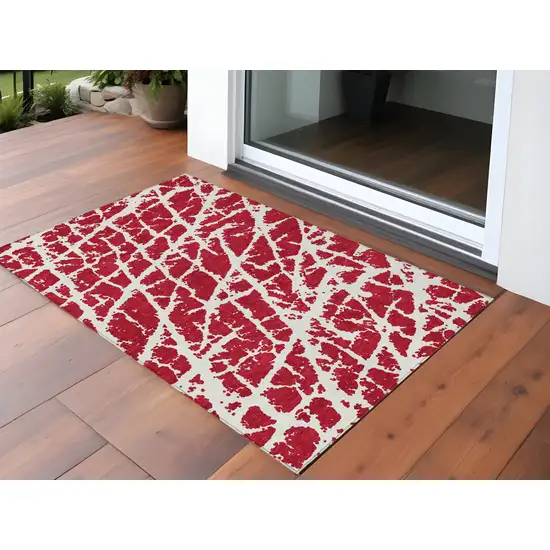 Red and White Abstract Washable Non Skid Indoor Outdoor Area Rug Photo 1