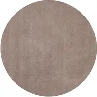 Photo of Round Beige Plain Indoor Area Rug