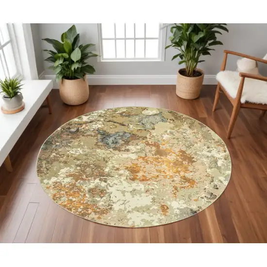 8' Gold and Ivory Round Power Loom Area Rug Photo 1