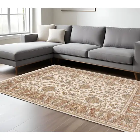 6' X 9' Rust And Ivory Oriental Power Loom Stain Resistant Area Rug With Fringe Photo 1