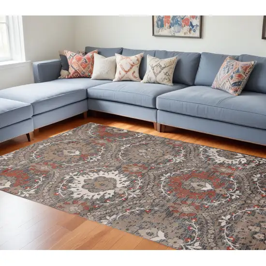 Rust Floral Stain Resistant Area Rug Photo 1