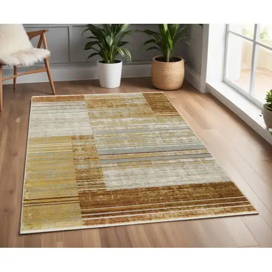 Rust Gold Blue Grey Ivory And Tan Geometric Power Loom Stain Resistant Area Rug With Fringe Photo 1