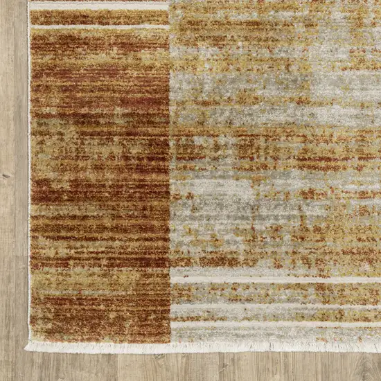 Rust Gold Blue Grey Ivory And Tan Geometric Power Loom Stain Resistant Area Rug With Fringe Photo 3