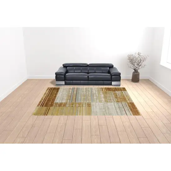 Rust Gold Blue Grey Ivory And Tan Geometric Power Loom Stain Resistant Area Rug With Fringe Photo 2