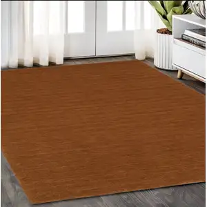 Photo of Rust Wool Hand Tufted Area Rug