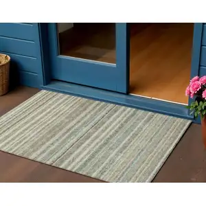 Photo of Sage Mint Green And Beige Striped Washable Indoor Outdoor Area Rug