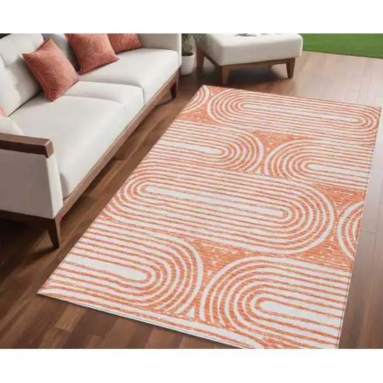 Orange and Ivory Abstract Washable Non Skid Indoor Outdoor Area Rug Photo 1