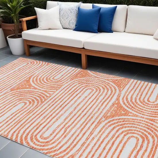 Orange and Ivory Abstract Washable Non Skid Indoor Outdoor Area Rug Photo 1