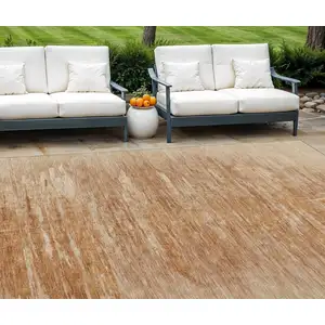 Photo of Salmon And Copper Abstract Washable Indoor Outdoor Area Rug