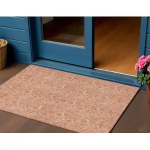 Photo of Salmon And Copper Floral Washable Indoor Outdoor Area Rug