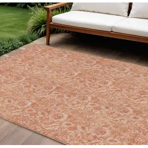 Photo of Salmon And Copper Floral Washable Indoor Outdoor Area Rug