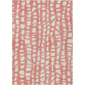 Photo of Salmon And Ivory Abstract Washable Indoor Outdoor Area Rug