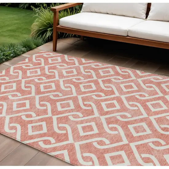 Salmon And Ivory Geometric Washable Indoor Outdoor Area Rug Photo 1