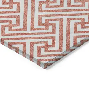 Photo of Salmon And Ivory Geometric Washable Indoor Outdoor Area Rug