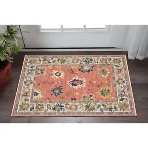 Photo of Salmon Blue And Yellow Oriental Area Rug With Fringe