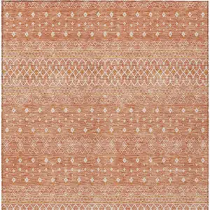 Photo of Salmon Gold And Ivory Tribal Washable Indoor Outdoor Area Rug