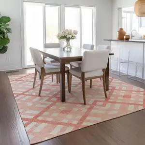 Photo of Salmon Peach And Ivory Geometric Washable Indoor Outdoor Area Rug