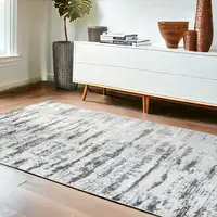 Photo of Silver Abstract Washable Non Skid Area Rug With Fringe