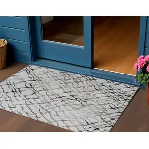 Photo of Silver Gray And Charcoal Abstract Washable Indoor Outdoor Area Rug