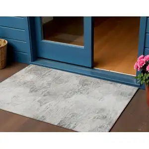 Photo of Silver Gray And Ivory Abstract Washable Indoor Outdoor Area Rug