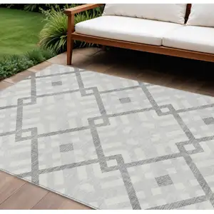 Photo of Silver Gray And Ivory Geometric Washable Indoor Outdoor Area Rug