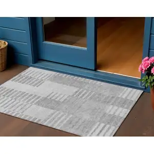 Photo of Silver Gray And Ivory Striped Washable Indoor Outdoor Area Rug