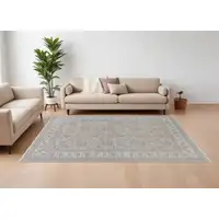 Photo of Silver Taupe and Blue Oriental Power Loom Worn Faded Area Rug With Fringe