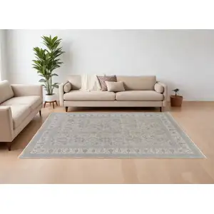 Photo of Silver Taupe and Blue Oriental Power Loom Worn Faded Area Rug With Fringe