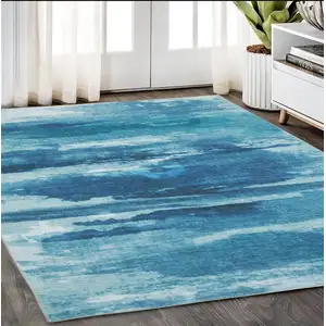 Photo of Sky Blue And Ivory Abstract Distressed Area Rug