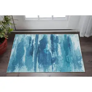 Photo of Sky Blue And Ivory Abstract Distressed Area Rug