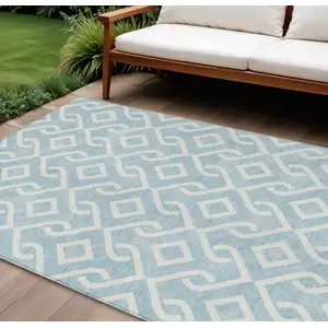 Photo of Sky Blue And Ivory Geometric Washable Indoor Outdoor Area Rug