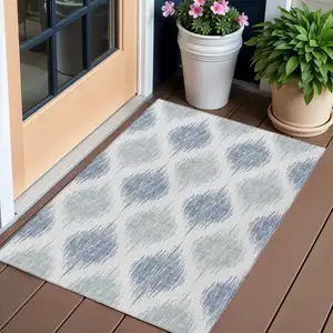 Photo of Sky Blue Ivory And Denim Blue Ikat Washable Indoor Outdoor Area Rug