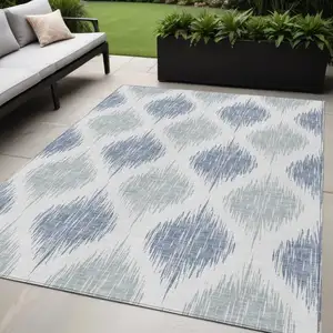 Photo of Sky Blue Ivory And Denim Blue Ikat Washable Indoor Outdoor Area Rug