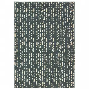 Photo of Steel Blue And Ivory Abstract Power Loom Stain Resistant Area Rug