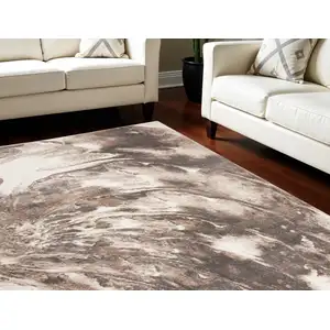 Photo of Tan Abstract Power Loom Area Rug