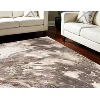 Photo of Tan Abstract Power Loom Area Rug