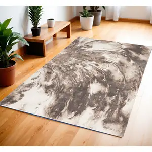 Photo of Tan Abstract Power Loom Area Rug