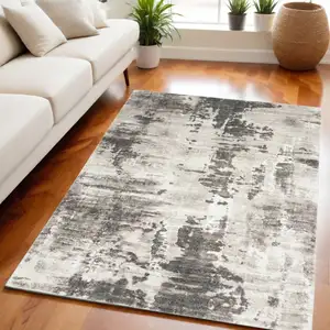 Photo of Tan Abstract Power Loom Area Rug