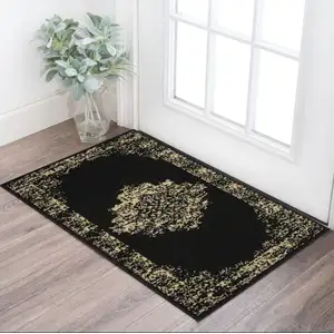 Photo of Tan And Black Medallion Distressed Area Rug