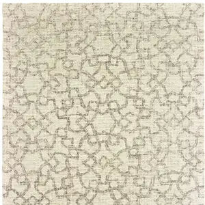 Photo of Tan And Ivory Wool Geometric Hand Tufted Area Rug