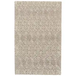 Photo of Tan And Ivory Wool Geometric Tufted Handmade Stain Resistant Area Rug