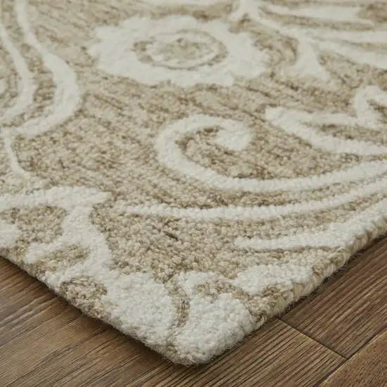 Tan And Ivory Wool Paisley Tufted Handmade Stain Resistant Area Rug Photo 4