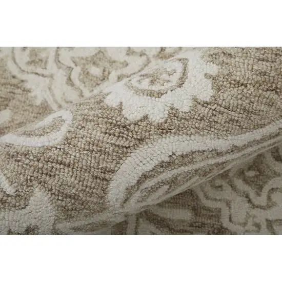 Tan And Ivory Wool Paisley Tufted Handmade Stain Resistant Area Rug Photo 6