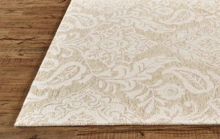 Tan And Ivory Wool Paisley Tufted Handmade Stain Resistant Area Rug Photo 3