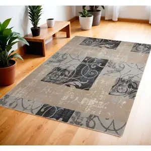 Photo of Tan Black and Ivory Floral Vines Area Rug