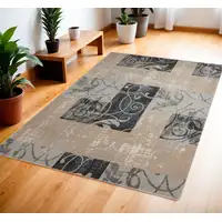 Photo of Tan Black and Ivory Floral Vines Area Rug