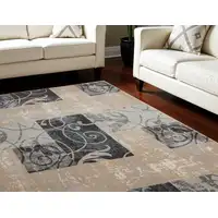 Photo of Tan Black and Ivory Floral Vines Non Skid Area Rug