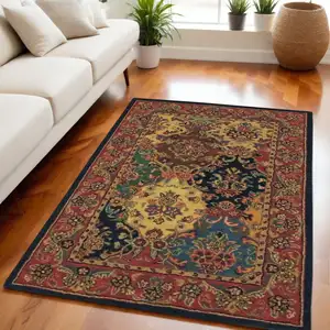 Photo of Tan Black and Red Wool Floral Area Rug