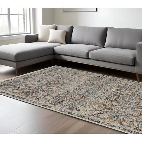 Tan and Blue Floral Power Loom Distressed Non Skid Area Rug With Fringe Photo 1