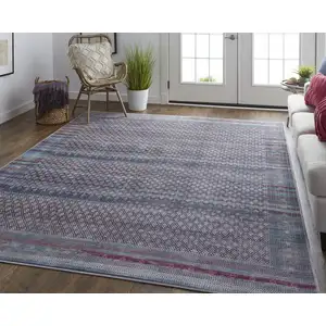 Photo of Tan Blue And Pink Striped Power Loom Area Rug